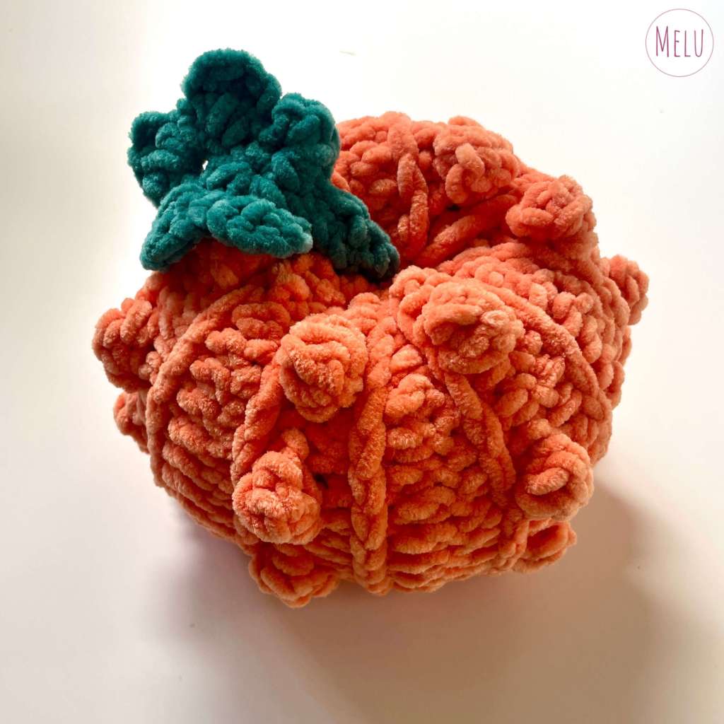 orange bobbly crocheted pumpkin Halloween/fall decoration made from chenille super chunky yarn